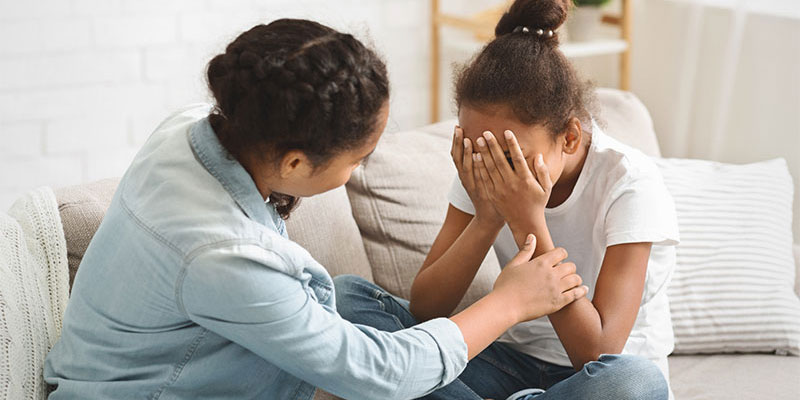 crying child, child being comforted, temper tantrum, family