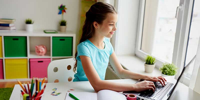 girl, at home learning space, homework, working on laptop, home office, organization
